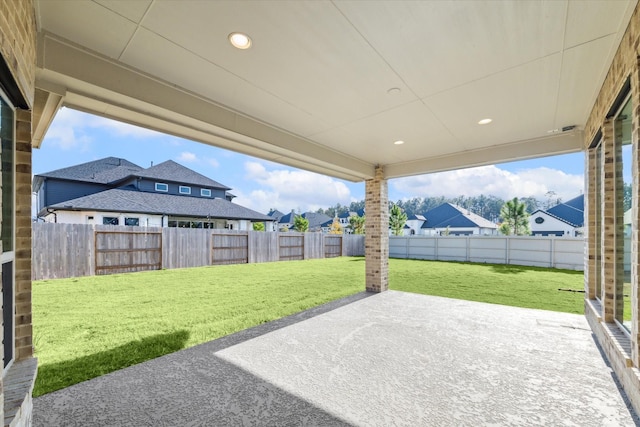 17471 Bayflower, Conroe, TX 77385 - fenced backyard with a patio area and a residential view