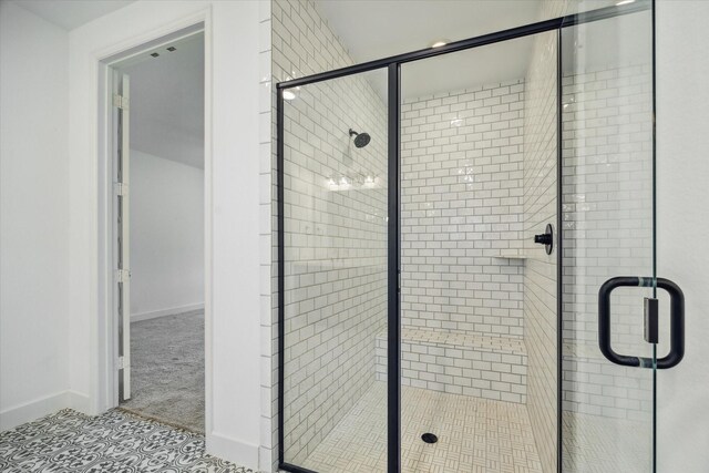 17471 Bayflower, Conroe, TX 77385 - bathroom with a shower stall and tile patterned flooring