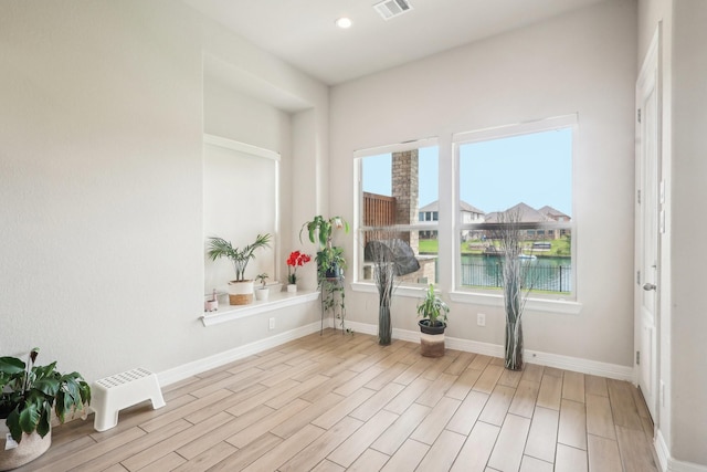 29446 Westhope Dr, Spring, TX 77386 - unfurnished room with wood finished floors, a water view, and recessed lighting