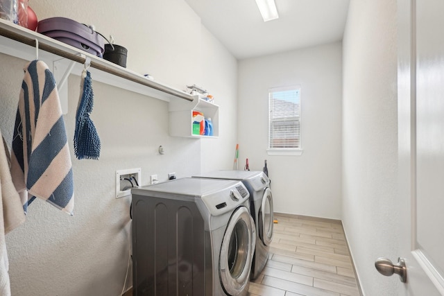 29446 Westhope Dr, Spring, TX 77386 - washroom featuring washing machine and dryer and wood finish floors