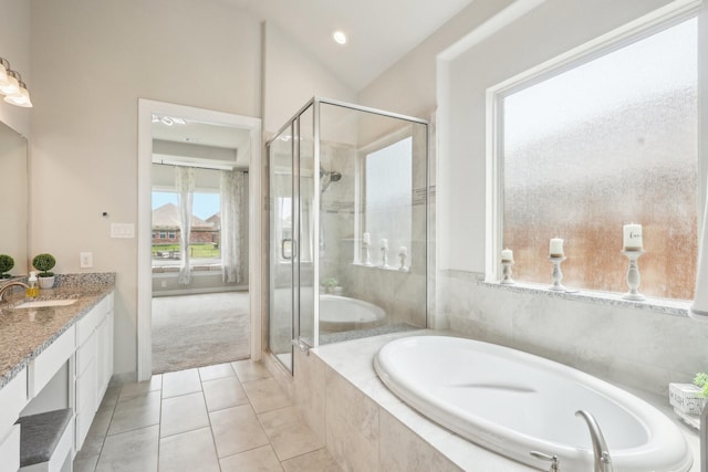 29446 Westhope Dr, Spring, TX 77386 - bathroom with vanity, a bath, a shower stall, tile patterned flooring, and lofted ceiling