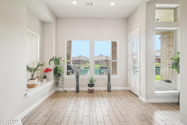 29446 Westhope Dr, Spring, TX 77386 - foyer entrance with wood finished floors, recessed lighting, and a water view