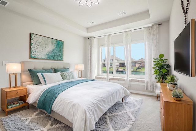 29446 Westhope Dr, Spring, TX 77386 - bedroom featuring a raised ceiling and light carpet