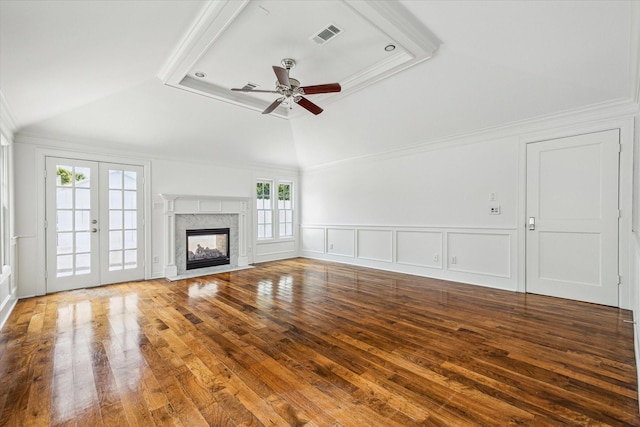 2127 Milford St, Houston, TX 77098 - unfurnished living room with a ceiling fan, hardwood / wood-style floors, vaulted ceiling, ornamental molding, and a premium fireplace