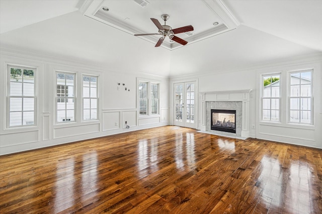 2127 Milford St, Houston, TX 77098 - unfurnished living room featuring wood finished floors, a ceiling fan, a fireplace, and a decorative wall