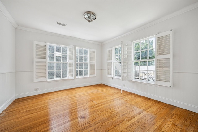 2127 Milford St, Houston, TX 77098 - spare room featuring light wood-style floors and ornamental molding