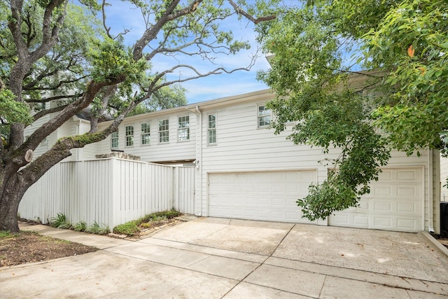 2127 Milford St, Houston, TX 77098 - view of property exterior with driveway and a garage