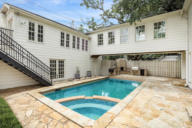 2127 Milford St, Houston, TX 77098 - view of swimming pool with a patio area, stairs, a pool with connected hot tub, french doors, and grilling area