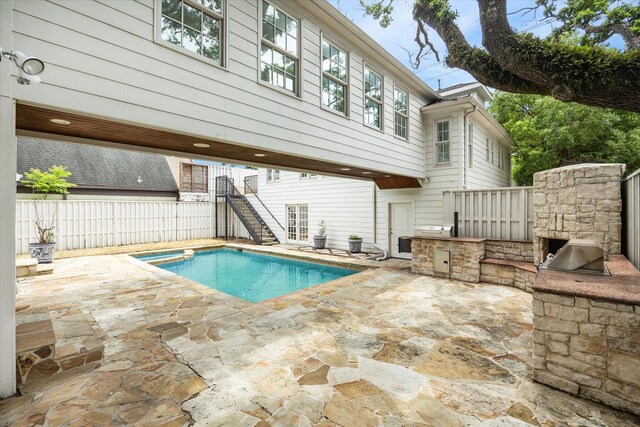 2127 Milford St, Houston, TX 77098 - view of pool featuring exterior kitchen, stairway, and a patio area