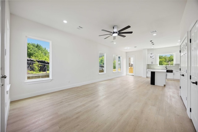 3210 Retta St A-B, Unit A-B Houston, TX 77026 - unfurnished living room featuring ceiling fan, light wood-style flooring, and recessed lighting