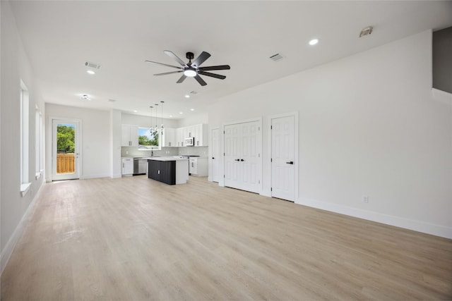 3210 Retta St A-B, Unit A-B Houston, TX 77026 - unfurnished living room featuring ceiling fan, light wood-type flooring, and recessed lighting