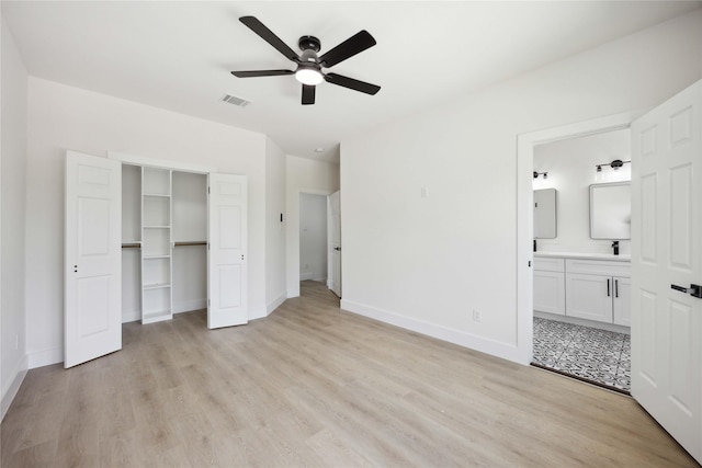 3210 Retta St A-B, Unit A-B Houston, TX 77026 - unfurnished bedroom with light wood finished floors, ensuite bath, a ceiling fan, and a spacious closet