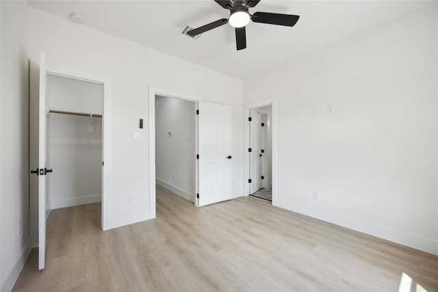 3210 Retta St A-B, Unit A-B Houston, TX 77026 - unfurnished bedroom featuring light wood-style floors, a walk in closet, and a ceiling fan