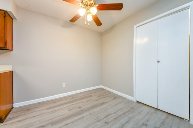 12905 Woodforest Blvd Unit 202, Houston, TX 77015 - unfurnished bedroom with light wood finished floors, a closet, and a ceiling fan