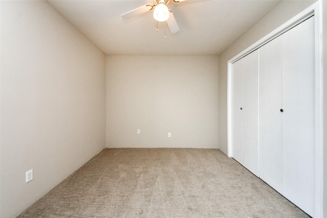 12905 Woodforest Blvd Unit 202, Houston, TX 77015 - unfurnished bedroom featuring carpet flooring, a closet, and a ceiling fan