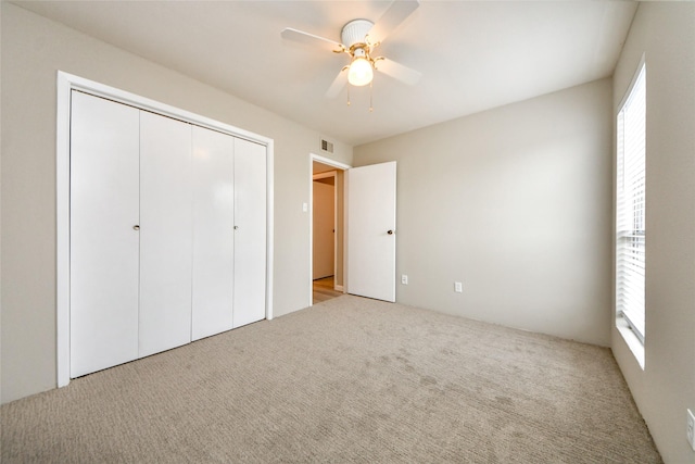 12905 Woodforest Blvd Unit 202, Houston, TX 77015 - unfurnished bedroom with carpet floors, a closet, and a ceiling fan