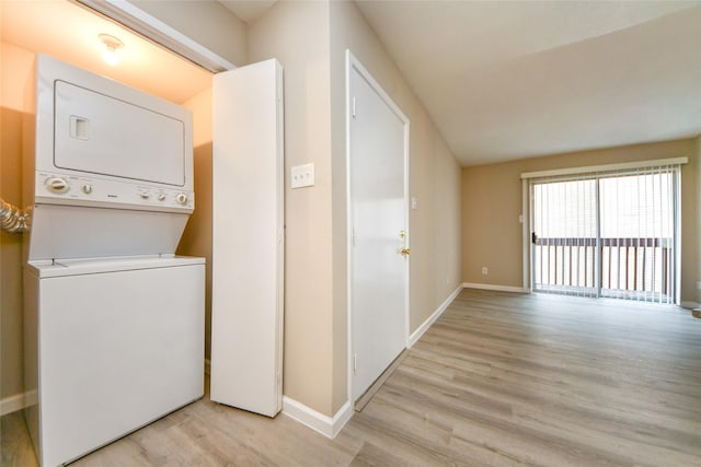 12905 Woodforest Blvd Unit 202, Houston, TX 77015 - washroom featuring stacked washer and clothes dryer and light wood-type flooring