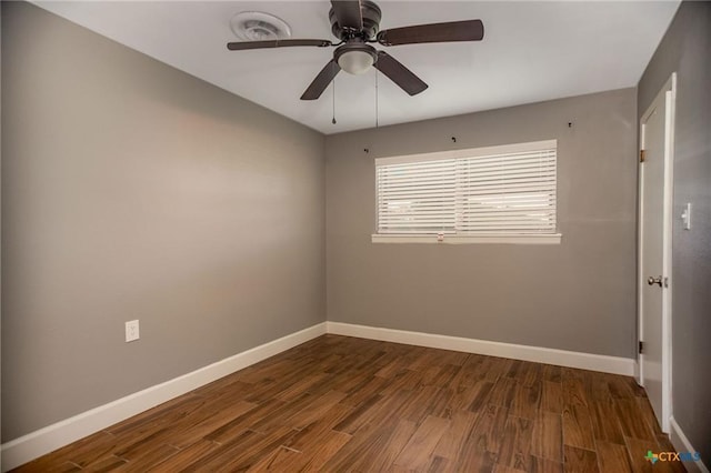 248 Park Rd, Port Lavaca, TX 77979 - empty room with dark wood finished floors and a ceiling fan