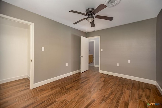 248 Park Rd, Port Lavaca, TX 77979 - unfurnished bedroom with wood finished floors and ceiling fan