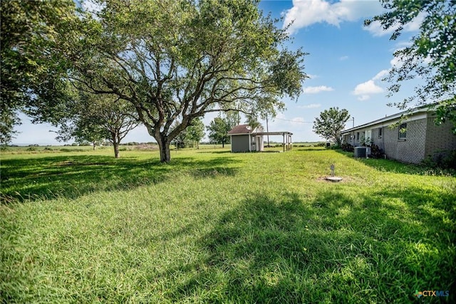 248 Park Rd, Port Lavaca, TX 77979 - view of grassy yard with a storage unit
