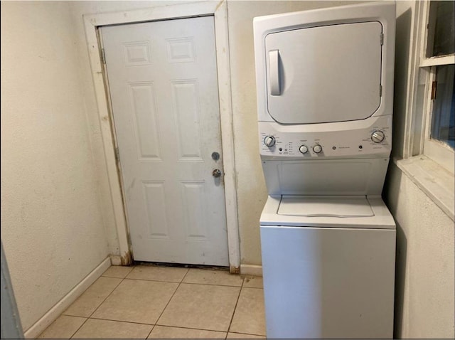 439 Terminal St, Houston, TX 77020 - washroom with stacked washer / drying machine and light tile patterned flooring