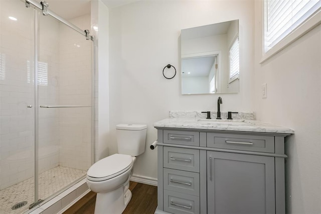 52 Oyster Creek Ct, Lake Jackson, TX 77566 - bathroom with wood finished floors, vanity, and a shower stall