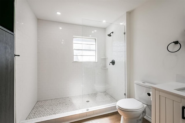 52 Oyster Creek Ct, Lake Jackson, TX 77566 - full bath with a tile shower, vanity, wood finished floors, and recessed lighting