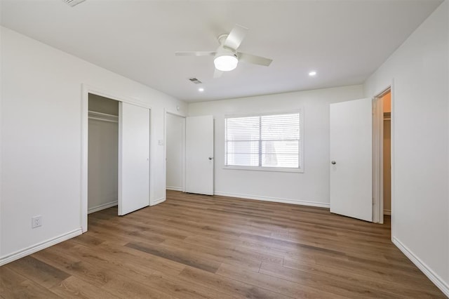 52 Oyster Creek Ct, Lake Jackson, TX 77566 - unfurnished bedroom featuring wood finished floors, ceiling fan, recessed lighting, and a closet