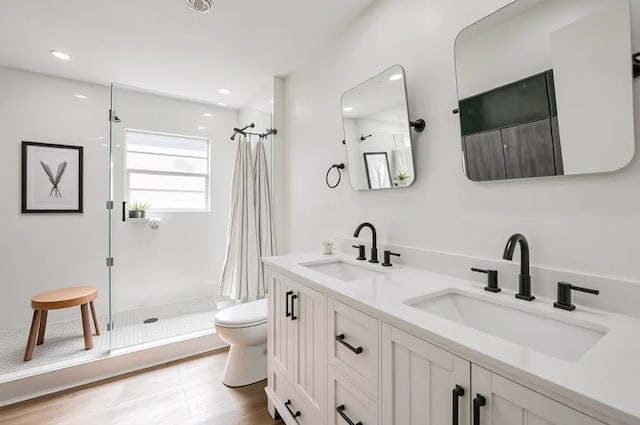 52 Oyster Creek Ct, Lake Jackson, TX 77566 - bathroom featuring a stall shower, double vanity, and recessed lighting