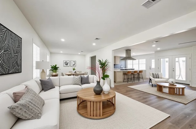 52 Oyster Creek Ct, Lake Jackson, TX 77566 - living area with light wood-style floors, recessed lighting, and french doors