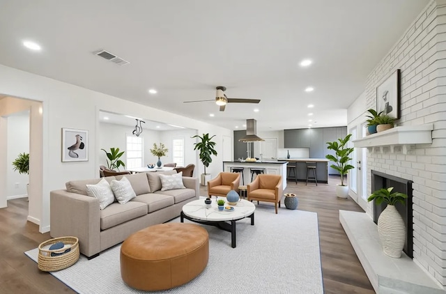 52 Oyster Creek Ct, Lake Jackson, TX 77566 - living room featuring wood finished floors, a brick fireplace, recessed lighting, and ceiling fan