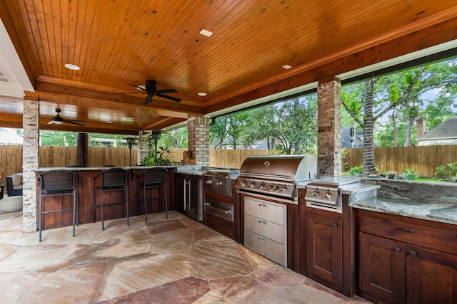 8706 Ashridge Park Dr, Spring, TX 77379 - fenced backyard featuring area for grilling, ceiling fan, and a patio