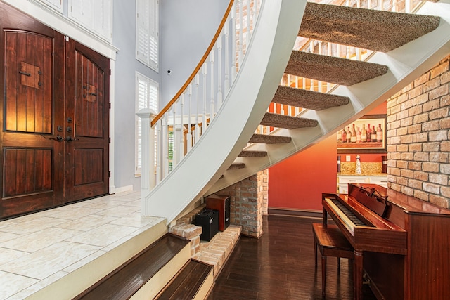 8706 Ashridge Park Dr, Spring, TX 77379 - foyer entrance featuring stairs, wood-type flooring, and a high ceiling