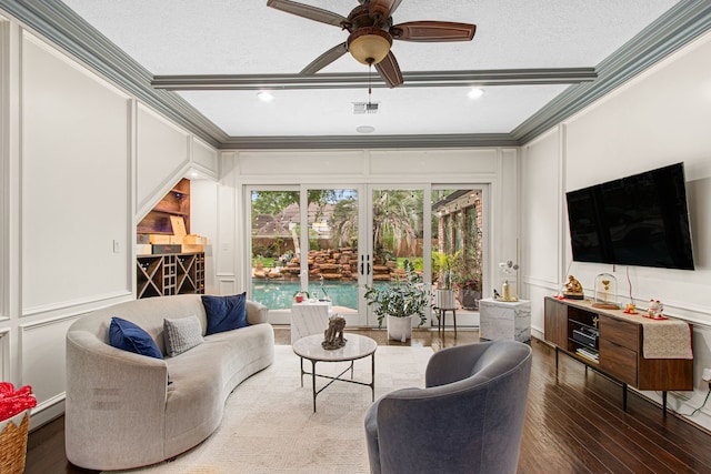 8706 Ashridge Park Dr, Spring, TX 77379 - living area with a decorative wall, crown molding, a ceiling fan, french doors, and wood finished floors