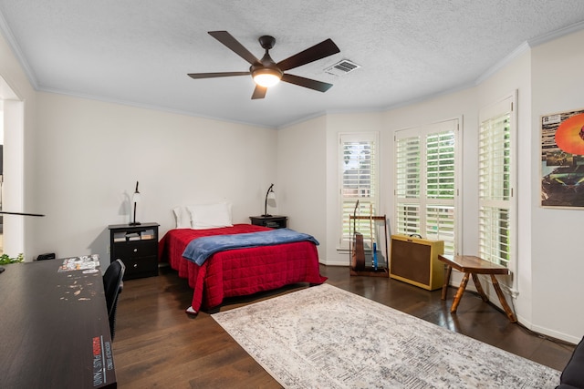 8706 Ashridge Park Dr, Spring, TX 77379 - bedroom featuring wood finished floors, crown molding, a ceiling fan, and a textured ceiling