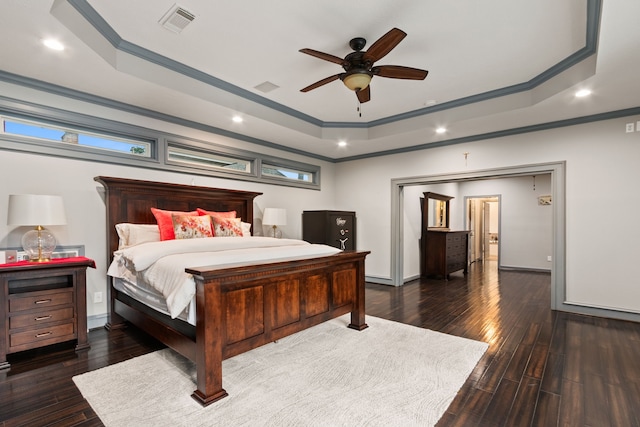 8706 Ashridge Park Dr, Spring, TX 77379 - bedroom featuring a raised ceiling, ornamental molding, recessed lighting, dark wood-type flooring, and ceiling fan