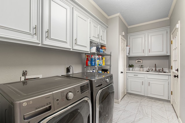 8706 Ashridge Park Dr, Spring, TX 77379 - washroom featuring cabinet space, washing machine and clothes dryer, light marble finish flooring, a textured ceiling, and ornamental molding