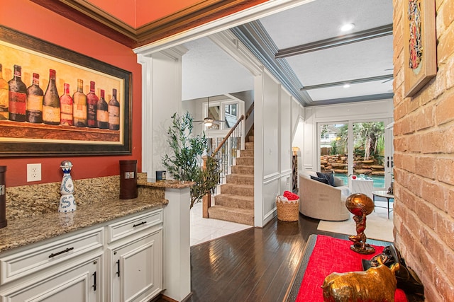 8706 Ashridge Park Dr, Spring, TX 77379 - bar area featuring stairway, wood-type flooring, and ornamental molding