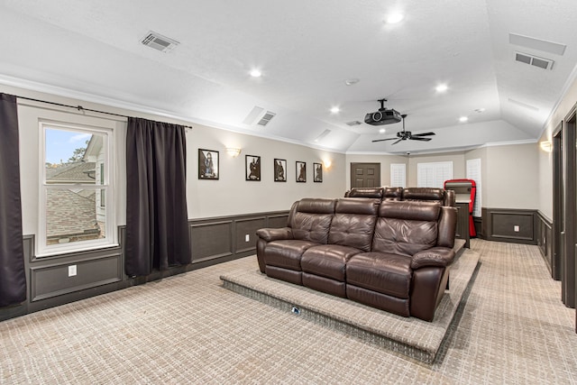 8706 Ashridge Park Dr, Spring, TX 77379 - home theater room with light carpet, wainscoting, crown molding, vaulted ceiling, and ceiling fan