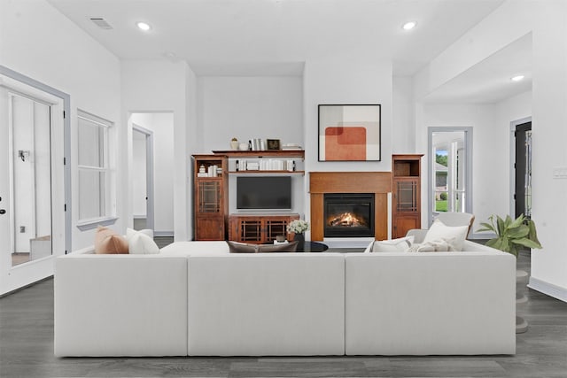 29 Westwood Dr W, Trinity, TX 75862 - living room featuring dark wood finished floors, a glass covered fireplace, and recessed lighting