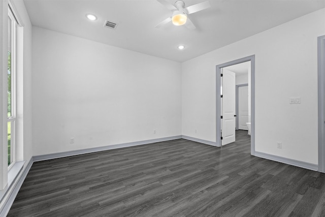29 Westwood Dr W, Trinity, TX 75862 - unfurnished room featuring dark wood-style floors, plenty of natural light, a ceiling fan, and recessed lighting