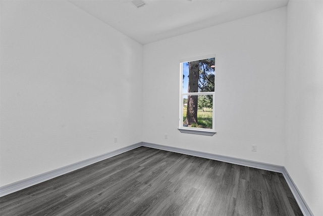 29 Westwood Dr W, Trinity, TX 75862 - spare room featuring dark wood-style floors and baseboards