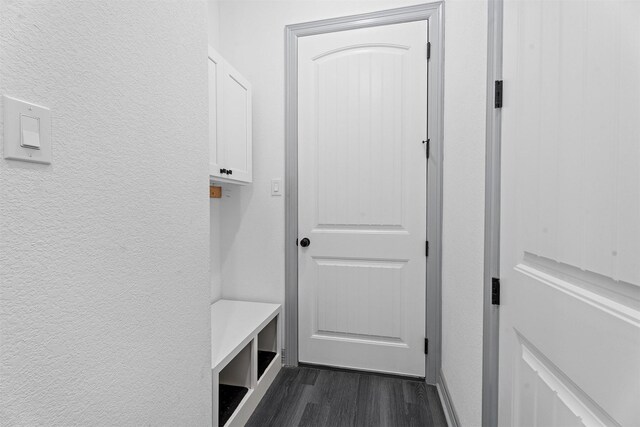 29 Westwood Dr W, Trinity, TX 75862 - mudroom with dark wood finished floors and a textured wall