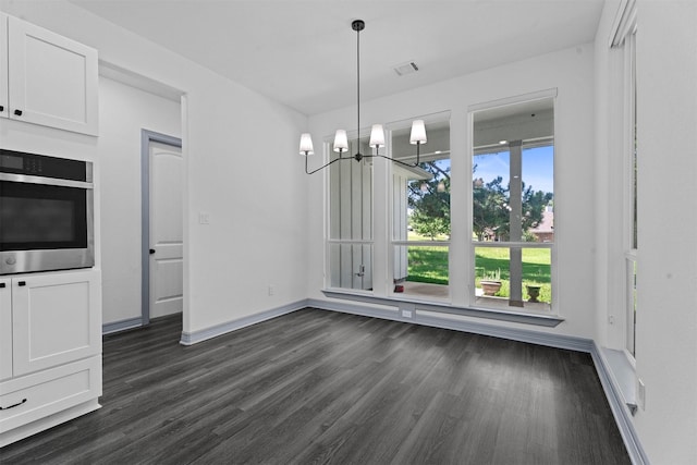 29 Westwood Dr W, Trinity, TX 75862 - unfurnished dining area with dark wood-type flooring and a chandelier