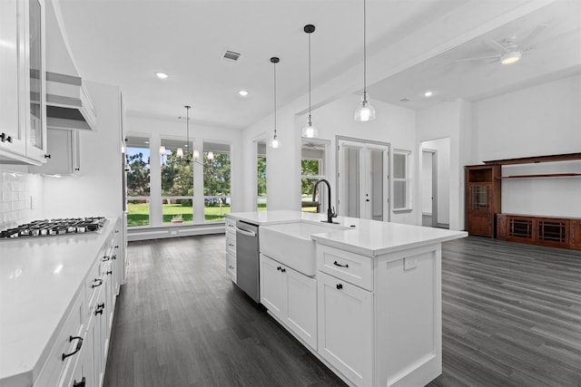 29 Westwood Dr W, Trinity, TX 75862 - kitchen with stainless steel appliances, dark wood-style flooring, recessed lighting, light countertops, and white cabinets