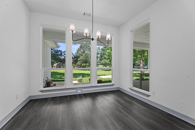 29 Westwood Dr W, Trinity, TX 75862 - unfurnished dining area featuring dark wood-style flooring and a chandelier