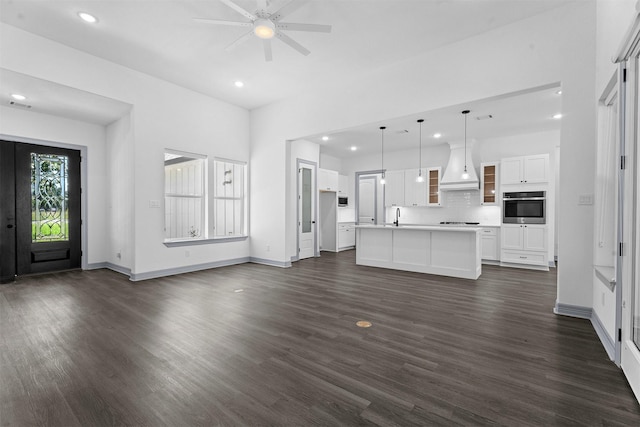 29 Westwood Dr W, Trinity, TX 75862 - unfurnished living room with dark wood-style flooring, recessed lighting, and ceiling fan