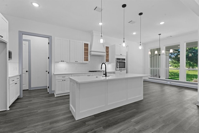 29 Westwood Dr W, Trinity, TX 75862 - kitchen featuring oven, recessed lighting, light countertops, decorative backsplash, and dark wood-style flooring