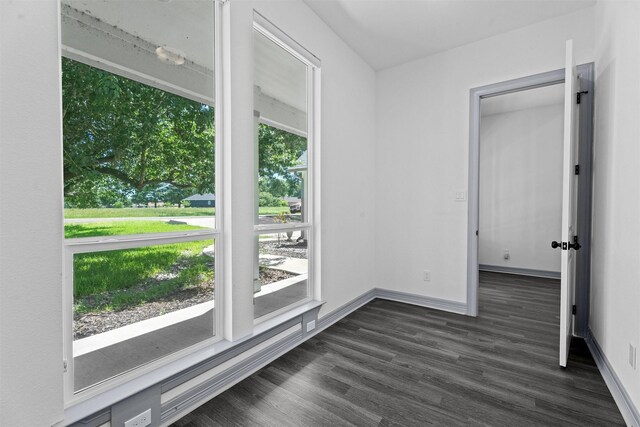 29 Westwood Dr W, Trinity, TX 75862 - empty room with dark wood finished floors and baseboards