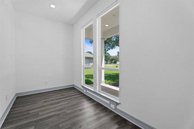 29 Westwood Dr W, Trinity, TX 75862 - empty room featuring dark wood-style flooring and recessed lighting